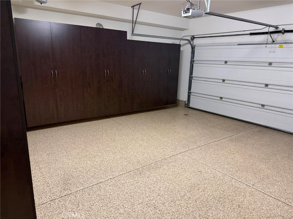 Epoxy garage floor and multiple storage cabinets. - 104 Strawberry Grove, Irvine CA 92620 - photo 15
