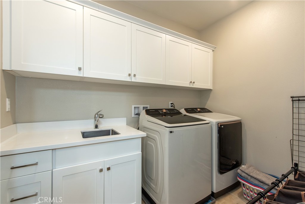 Second floor laundry with sink - 107 Pitch, Irvine CA 92618 - photo 10