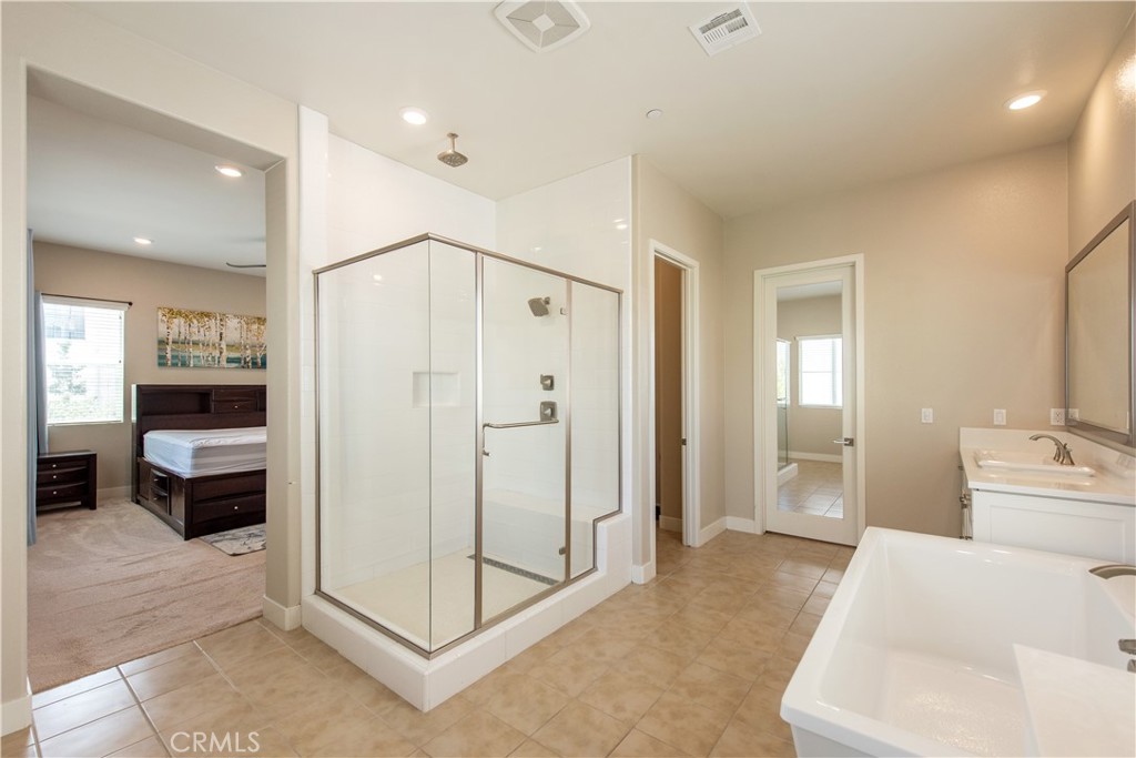 Another view of master bath with second walk-in closet - 107 Pitch, Irvine CA 92618 - photo 13