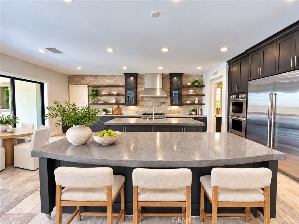 AI staged main kitchen - 109 Heather Mist, Irvine CA 92618 - photo 3