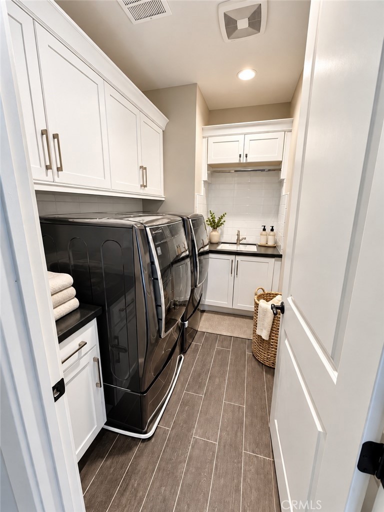 AI enhanced laundry room - 109 Heather Mist, Irvine CA 92618 - photo 13