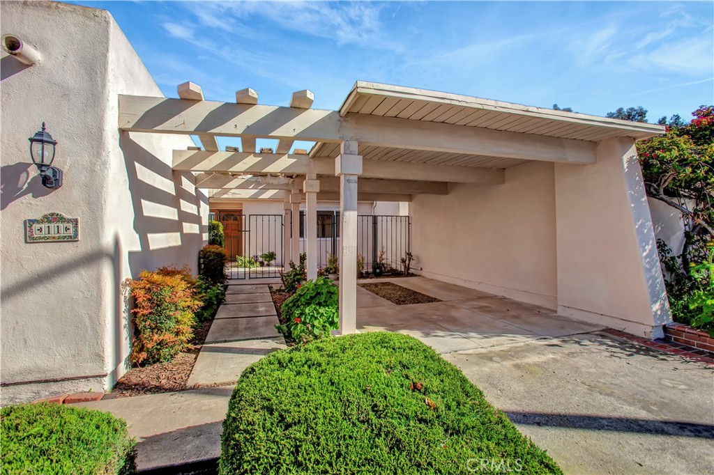 Gated courtyard entry with garage and covered carport - 11 Mandrake Way, Irvine CA 92612 - photo 1