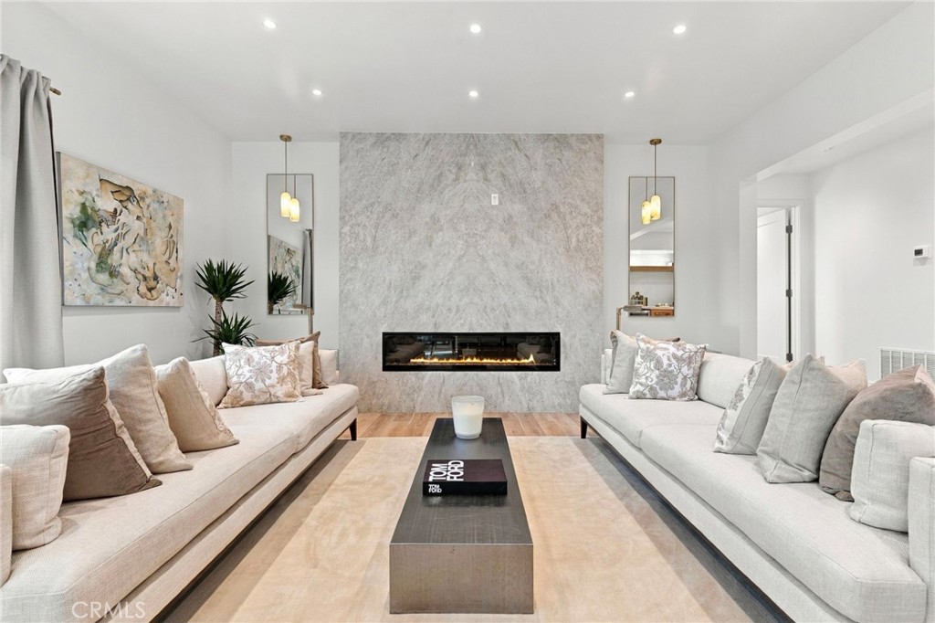 Stunning formal living room with dramatic fireplace - 11 Palos 55, Irvine CA 92612 - photo 2