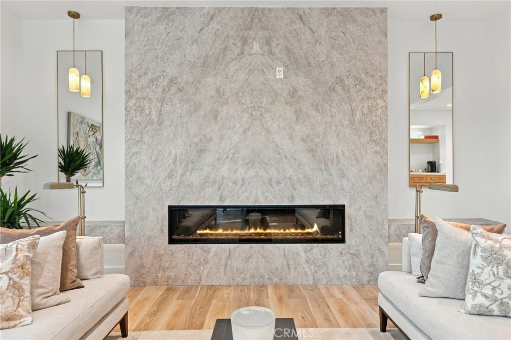 Floor to ceiling fireplace adds warmth and sophistication - 11 Palos 55, Irvine CA 92612 - photo 3