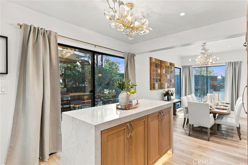Custom built island with stone countertop waterfall edges - 11 Palos 55, Irvine CA 92612 - photo 9