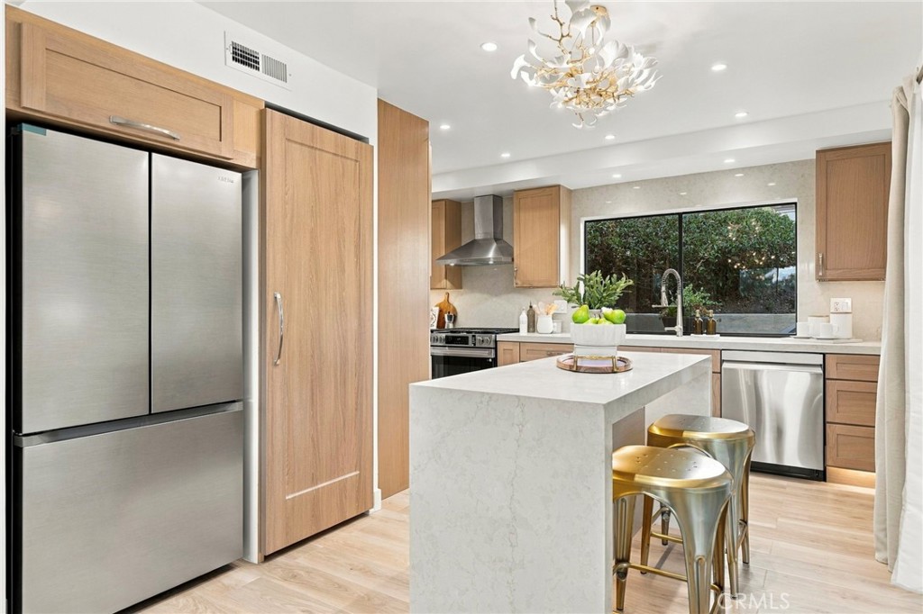 The kitchen is a dream come true with impeccably executed finishes - 11 Palos 55, Irvine CA 92612 - photo 10