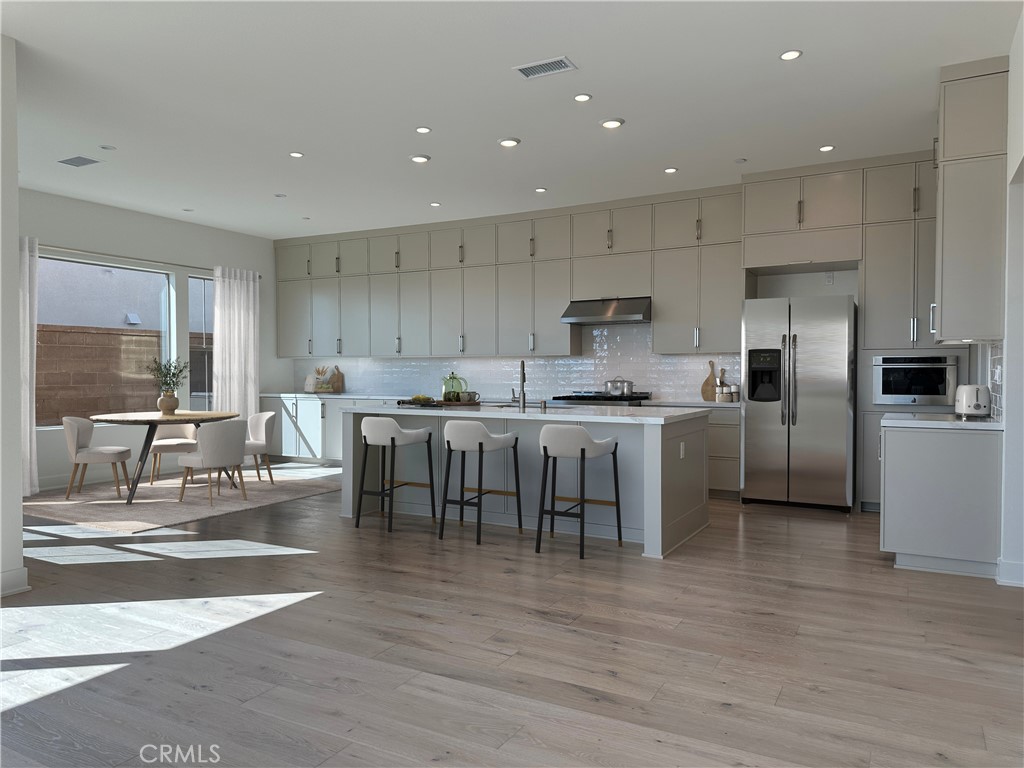 Photos shown are of model only and are virtually staged- not actual homesite. - 116 Awning, Irvine CA 92618 - photo 1