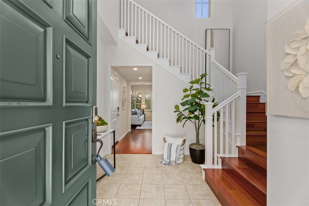Foyer with soaring ceiling and striking chandelier. - 117 Gemstone, Irvine CA 92620 - photo 2