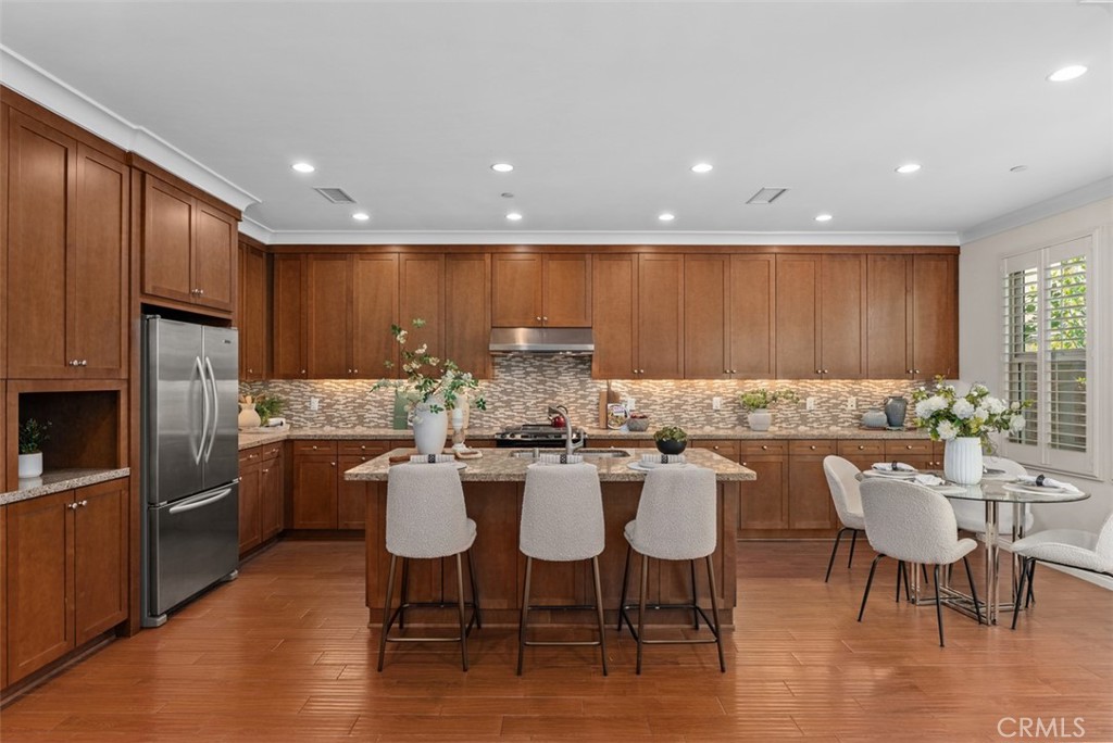 Beautifully upgraded kitchen with breakfast bar. - 117 Gemstone, Irvine CA 92620 - photo 8