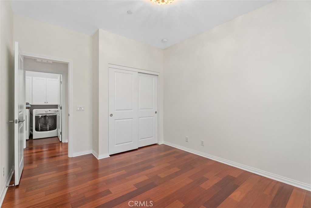 Third bedroom and view of laundry room. - 117 Gemstone, Irvine CA 92620 - photo 21