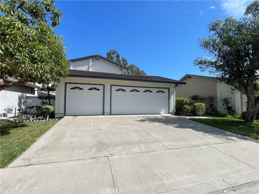 Large driveway and a 3 car garage - 12 Caraway, Irvine CA 92604 - photo 1