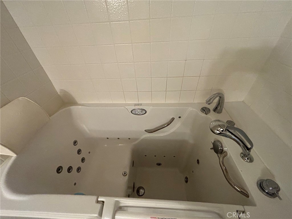 GUEST BATHROOM WITH WALK-IN WHIRLPOOL JETTED BATHTUB - 12 Lago Norte, Irvine CA 92612 - photo 10