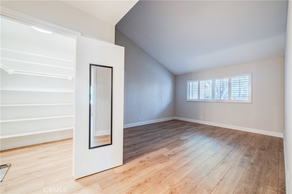 View of Primary closet and Primary Bedroom - 12 Springwater, Irvine CA 92604 - photo 12
