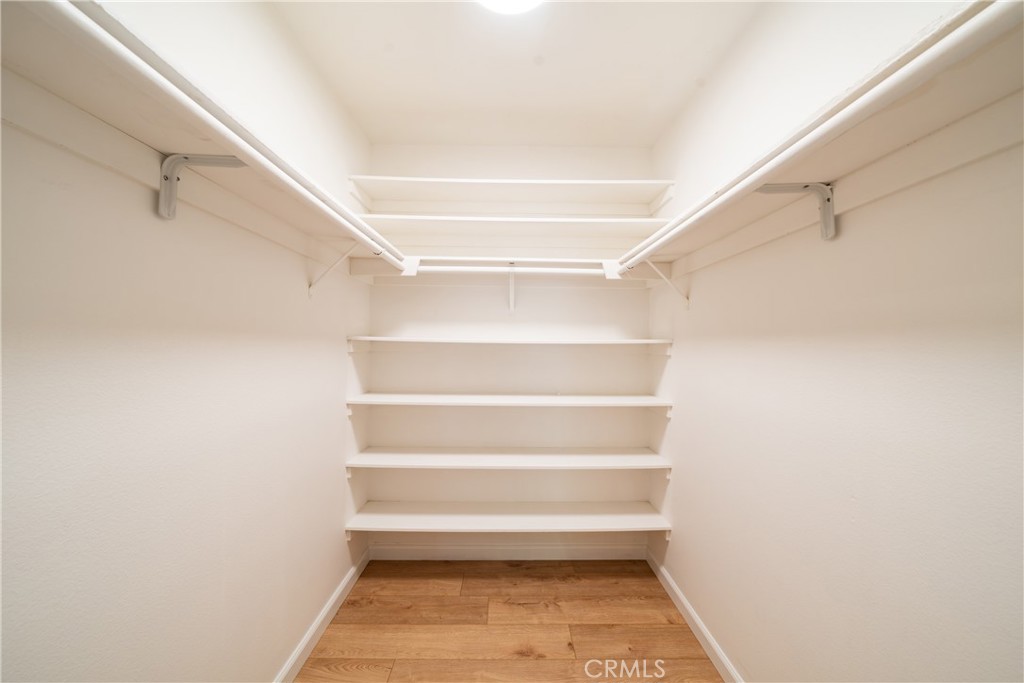 Primary bedroom walk-in closet - 12 Springwater, Irvine CA 92604 - photo 13