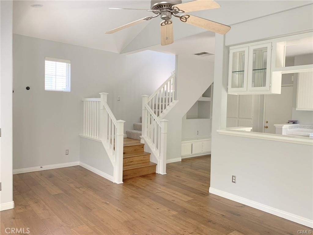 Beautiful wood flooring in the living room and kitchen - 126 Winslow Lane, Irvine CA 92620 - photo 2