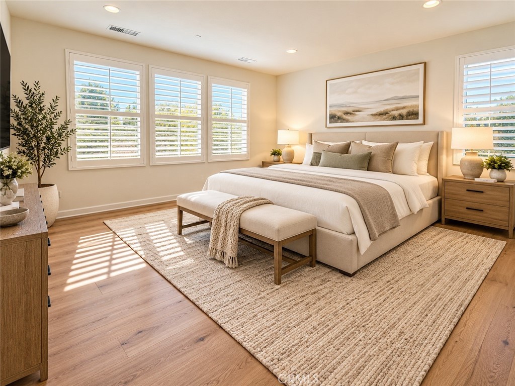 Virtually staged primary bedroom - 128 Carrotwood, Irvine CA 92618 - photo 5