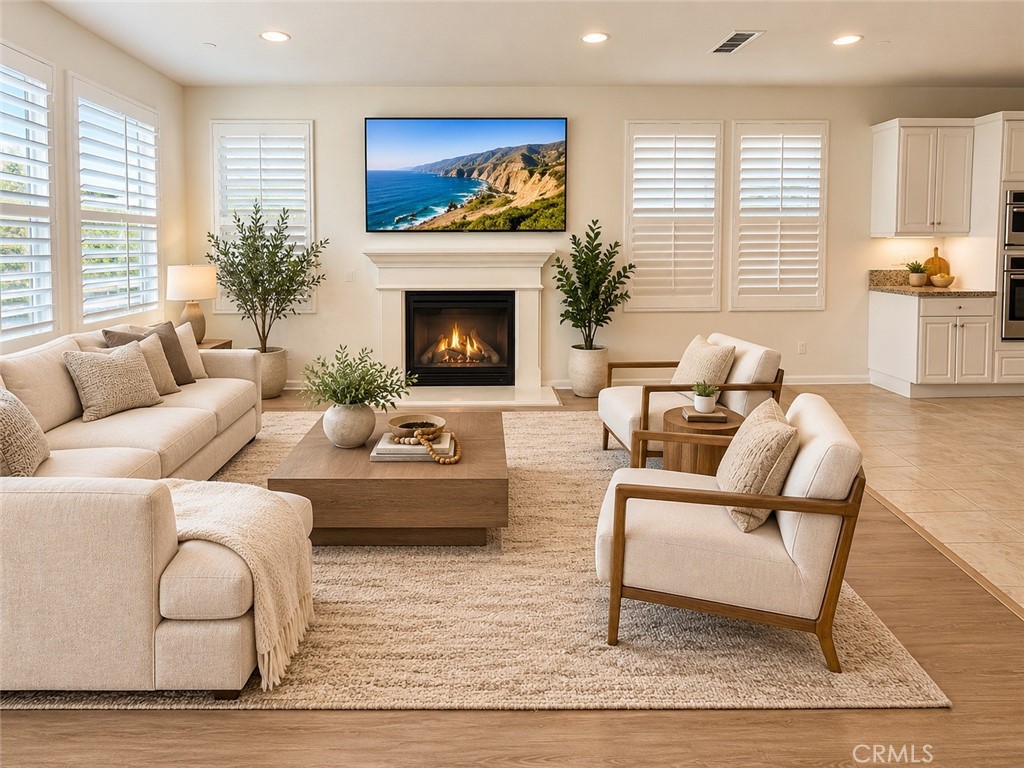 Virtually staged living room. - 128 Carrotwood, Irvine CA 92618 - photo 17
