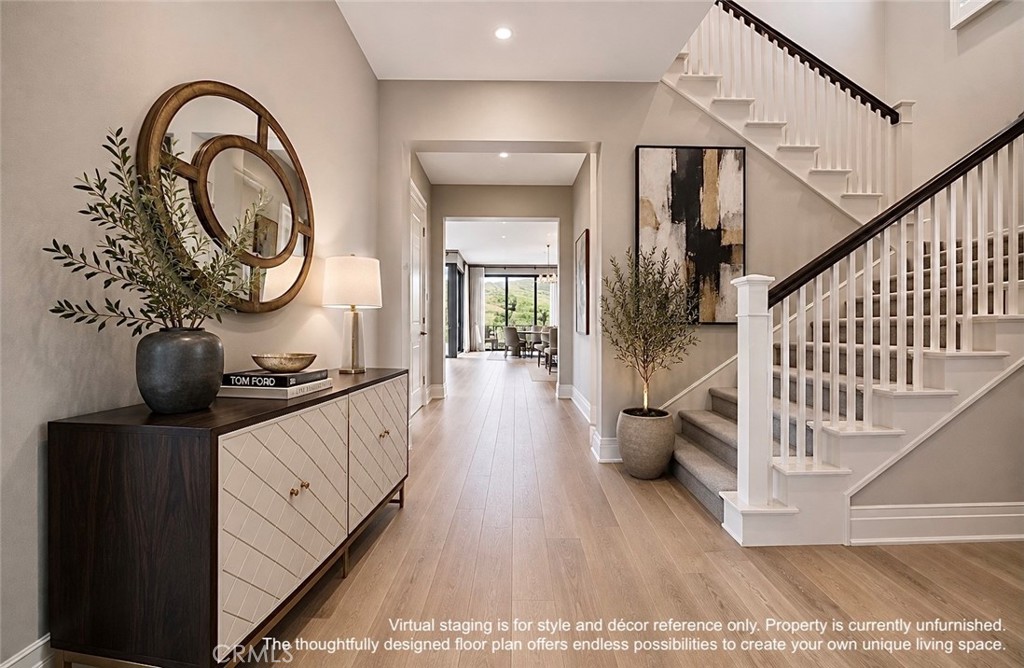 Virtual staging is for style and décor reference only. Property is currently unfurnished. The thoughtfully designed floo - 128 Roscomare, Irvine CA 92602 - photo 2