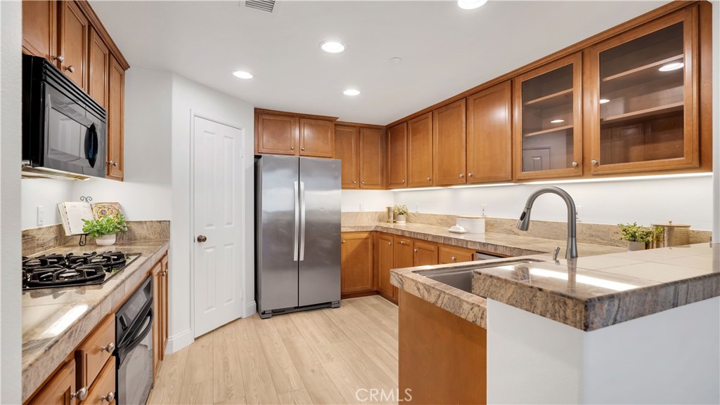 A chef's kitchen--the refrigerator is included. - 128 Talmadge, Irvine CA 92602 - photo 8