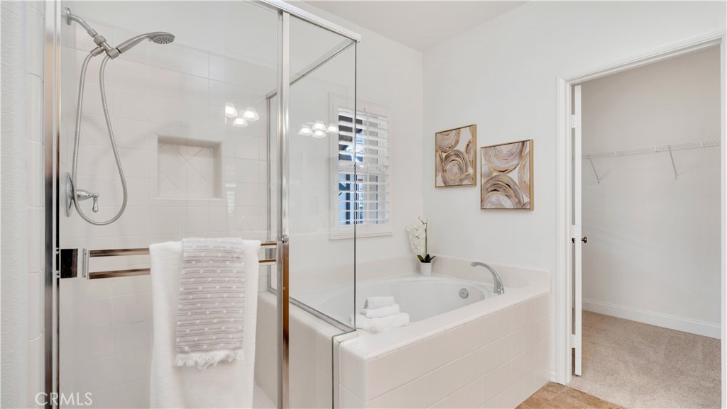 Separate shower with glass enclosure plus a soaking tub. - 128 Talmadge, Irvine CA 92602 - photo 13