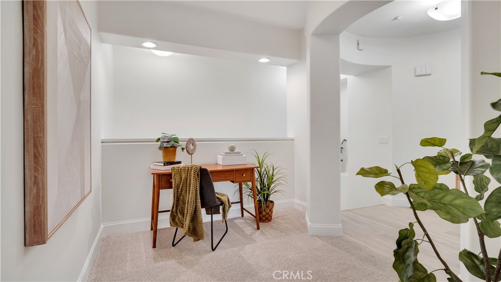 Just off the primary is a cozy loft, perfect for an office or comfy nook. - 128 Talmadge, Irvine CA 92602 - photo 15