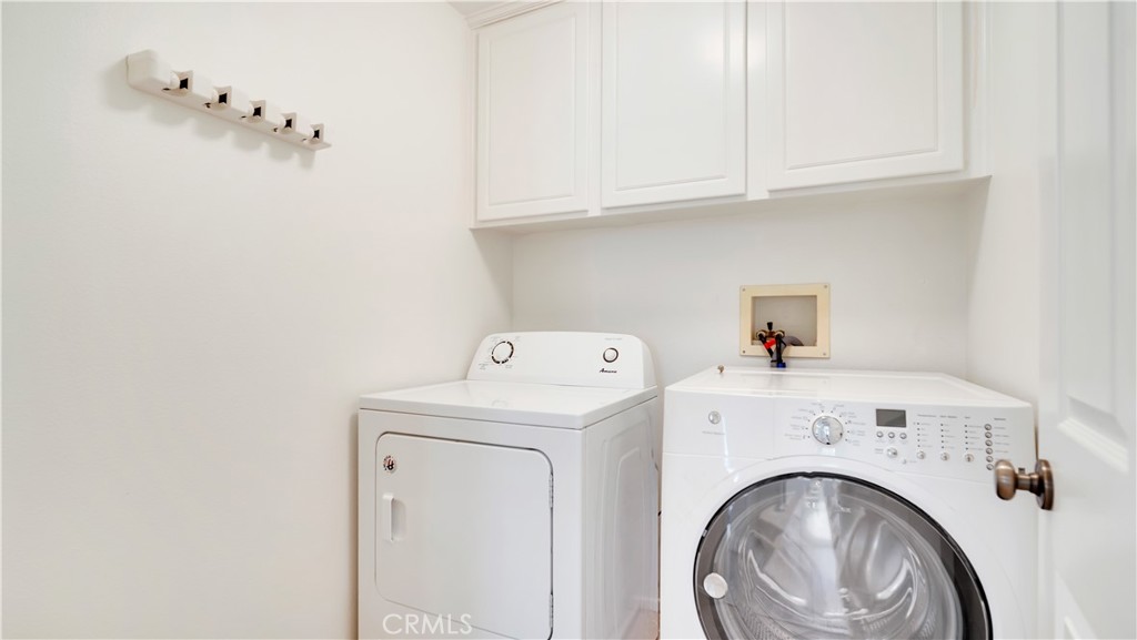 Separate laundry room. Washer and dryer are included. - 128 Talmadge, Irvine CA 92602 - photo 21