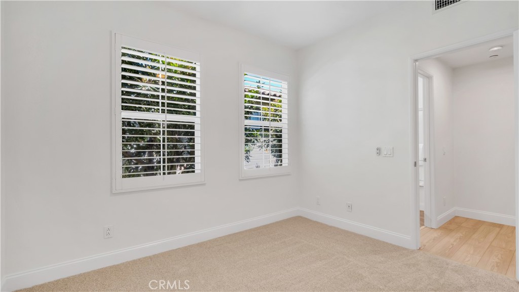 Third bedroom--Swiss Coffee on the walls and two tone designer carpet. Not showing in the picture, a new ceiling fan. Th - 128 Talmadge, Irvine CA 92602 - photo 24