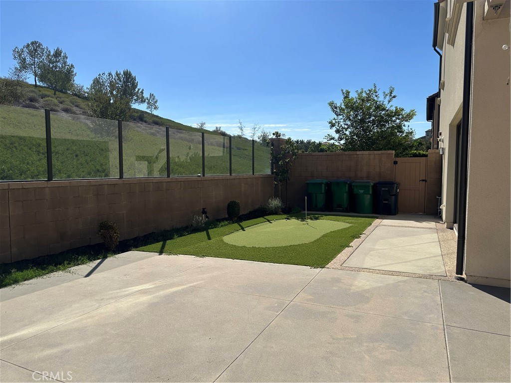 yard with putting green area - 134 Spotted Quail, Irvine CA 92618 - photo 26