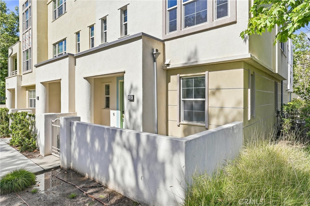End unit with a front patio area. Shares only one wall - 136 Acamar, Irvine CA 92618 - photo 1