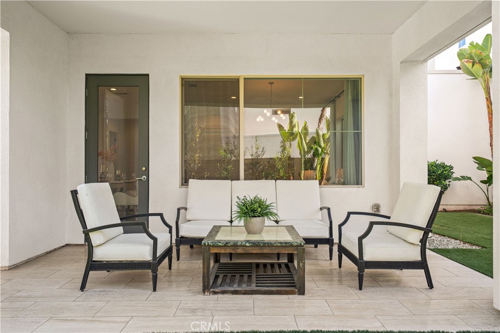 GLASS DOOR off the living room open to a covered California Room for easy indoor-outdoor living. - 136 Episode, Irvine CA 92618 - photo 21