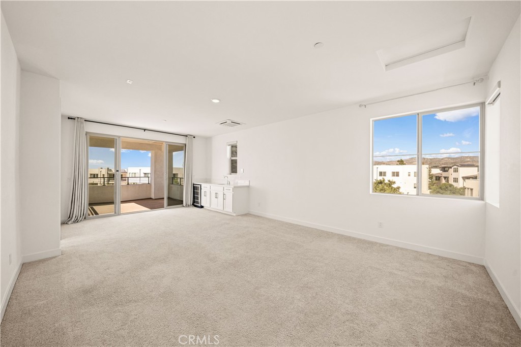The third floor features a SPACIOUS BONUS ROOM WITH ITS OWN DOOR for added privacy, opening to A COVERED BALCONY WITH RE - 136 Episode, Irvine CA 92618 - photo 52