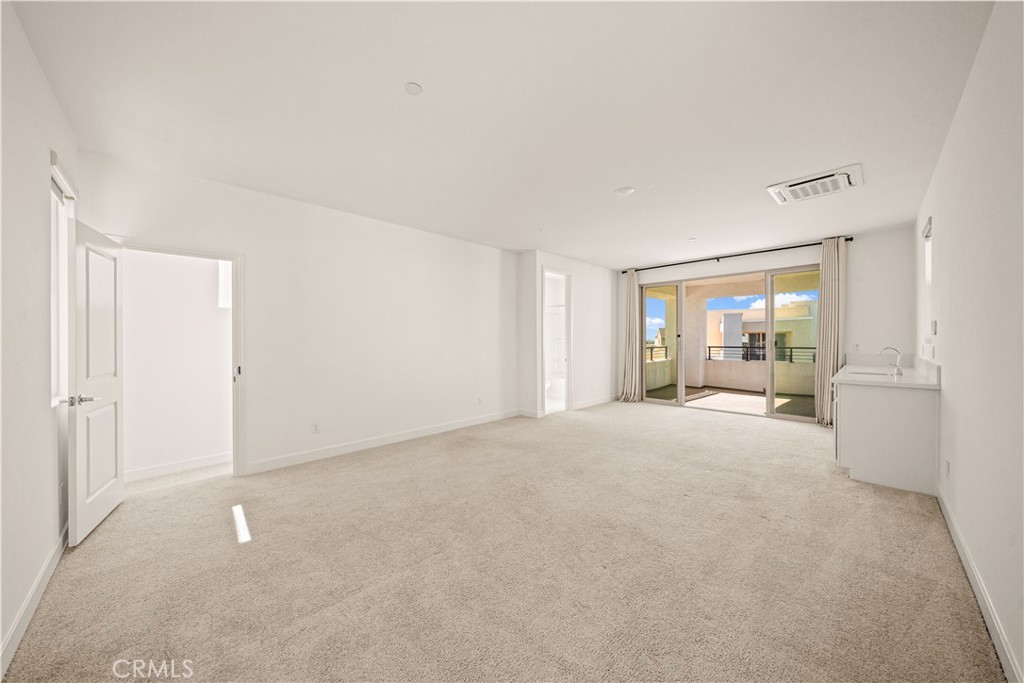 The third floor features a SPACIOUS BONUS ROOM WITH ITS OWN DOOR for added privacy, opening to A COVERED BALCONY WITH RE - 136 Episode, Irvine CA 92618 - photo 53