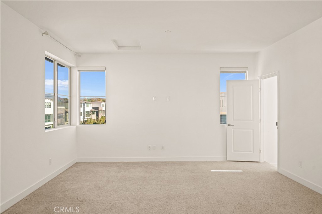 The third floor features a SPACIOUS BONUS ROOM WITH ITS OWN DOOR for added privacy, opening to A COVERED BALCONY WITH RE - 136 Episode, Irvine CA 92618 - photo 55