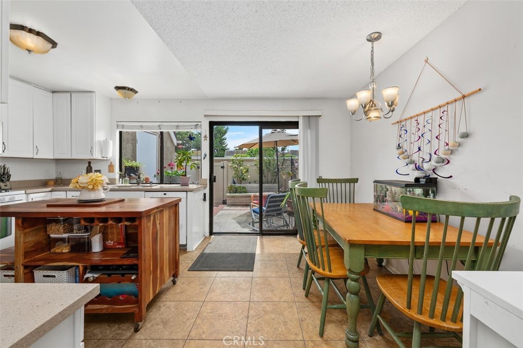 Dining area with sliding glass door opening to the enclosed patio. - 14 Greenleaf, Irvine CA 92604 - photo 10