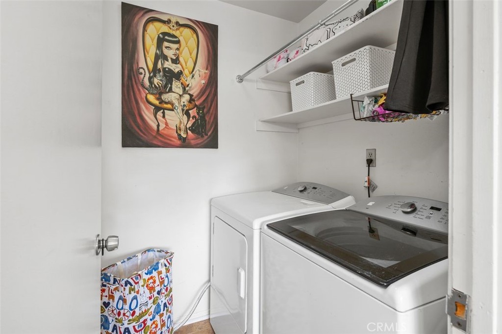 Separate indoor laundry area with included washer, dryer, and storage shelving. - 14 Greenleaf, Irvine CA 92604 - photo 17