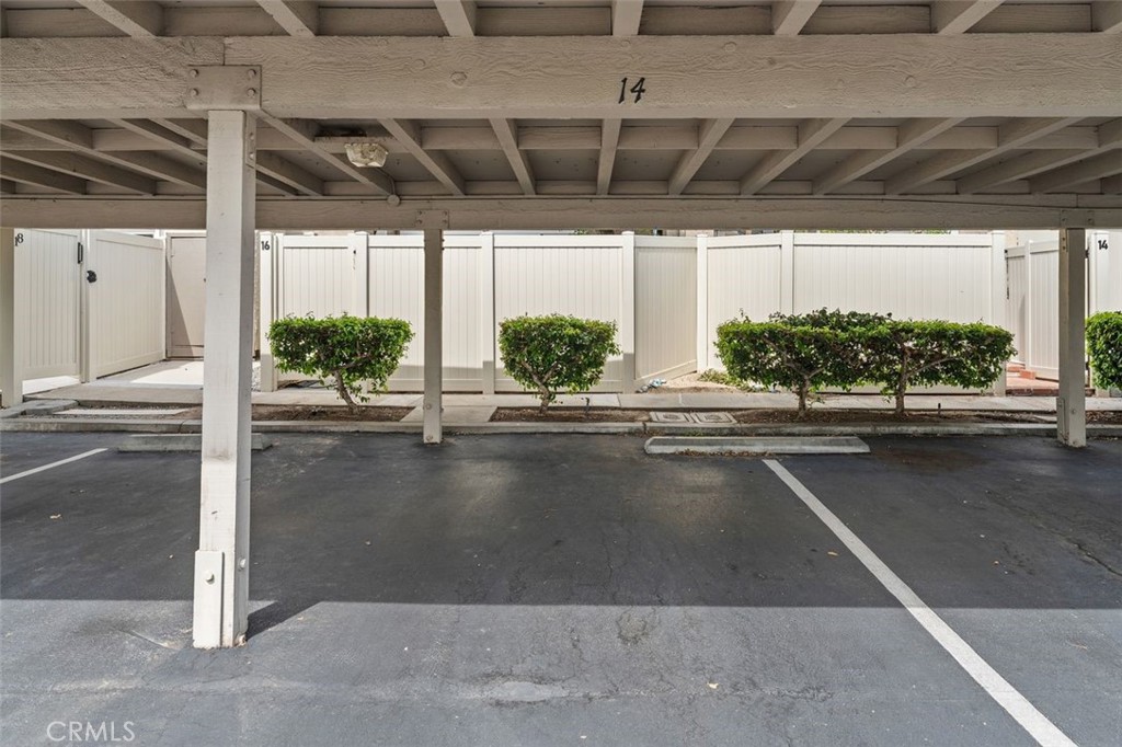 Assigned covered carport parking space #14 is right behind the patio. - 14 Greenleaf, Irvine CA 92604 - photo 32
