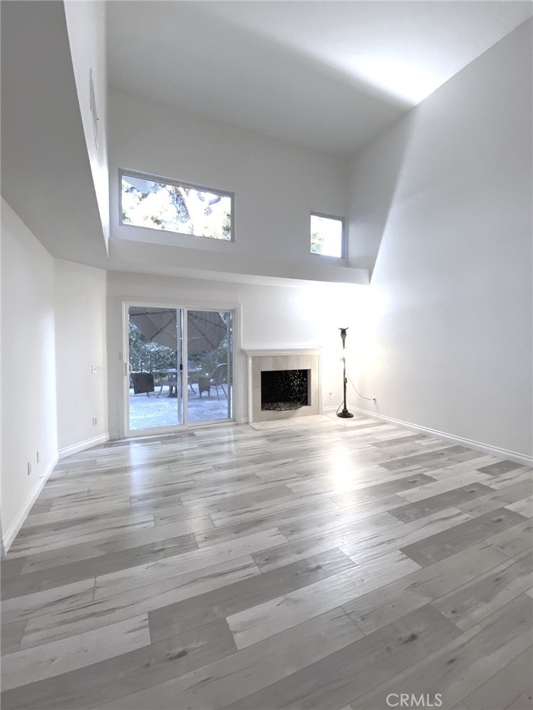 Large living room with fireplace and Vaulted ceilings - 14 Rainbow Lk 3, Irvine CA 92614 - photo 3