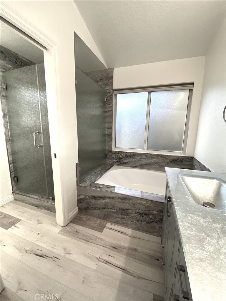 With a soaking tub and separate toilet / walk-in shower area - 14 Rainbow Lk 3, Irvine CA 92614 - photo 26