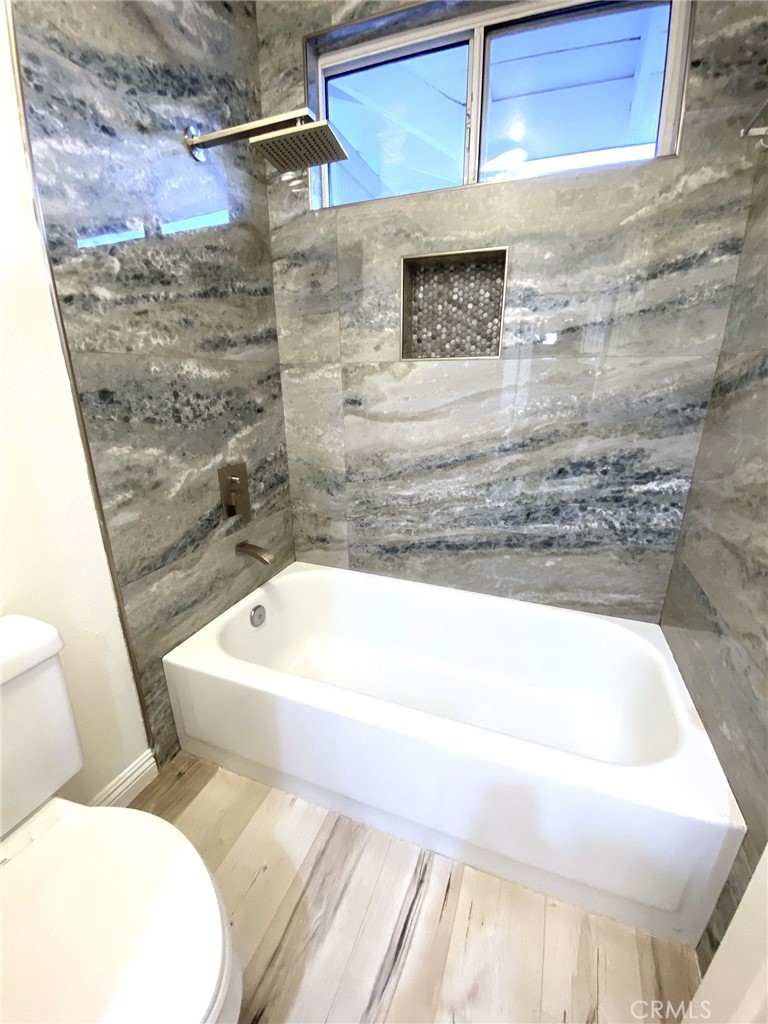 Toilet and shower-in tub with privacy door - 14 Rainbow Lk 3, Irvine CA 92614 - photo 33