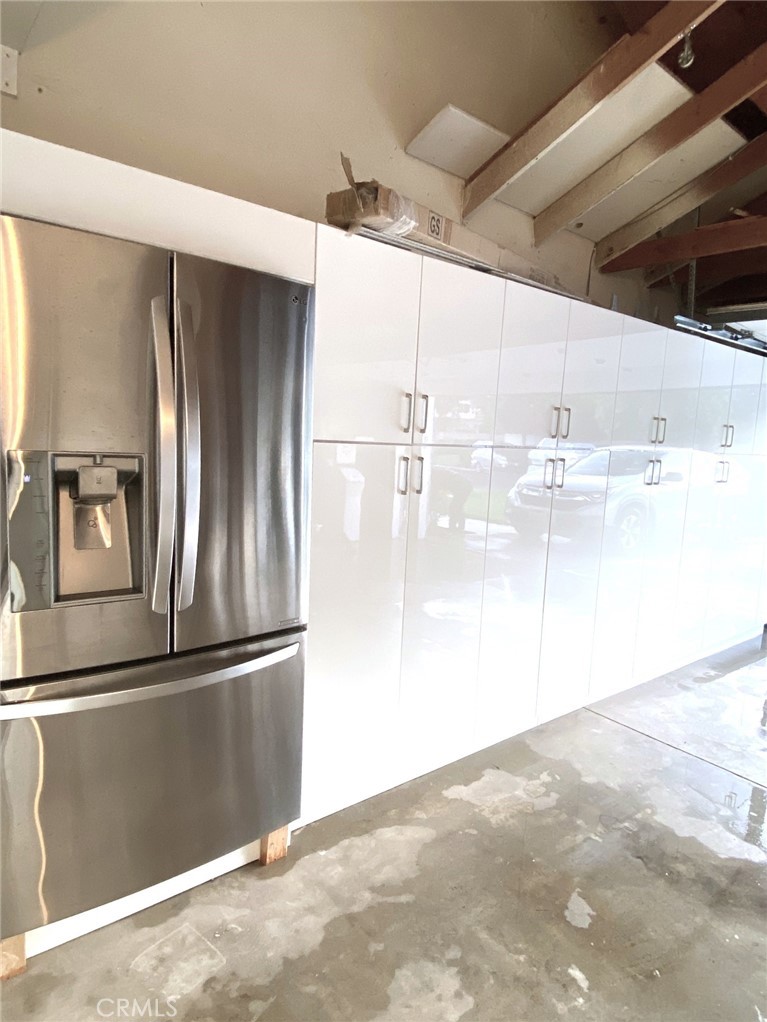 Large secondary refrigerator and tons of storage space in attached garage - 14 Rainbow Lk 3, Irvine CA 92614 - photo 43