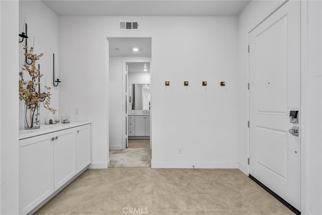 Tiled interior entry - 143 Baluster, Irvine CA 92618 - photo 2