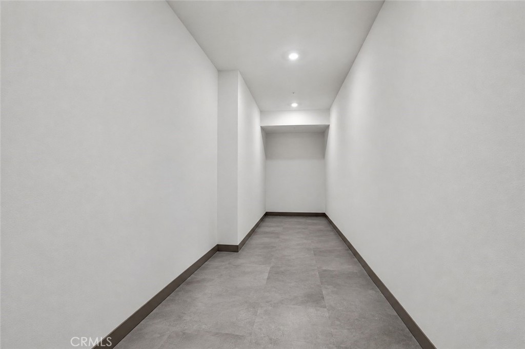 Additional 170 square feet of storage measuring 27.6 feet x 6 feet and floor to ceiling. - 143 Baluster, Irvine CA 92618 - photo 23
