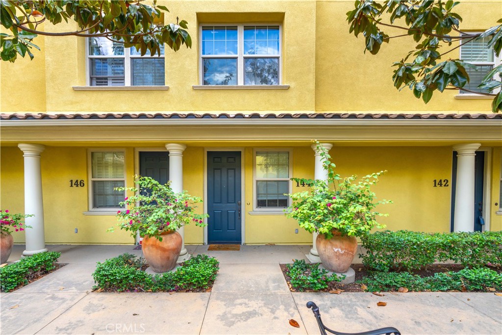 #144 - your new home - right in the middle of the courtyard with beautifully maintained foliage by the HOA. - 144 Pantheon, Irvine CA 92620 - photo 1