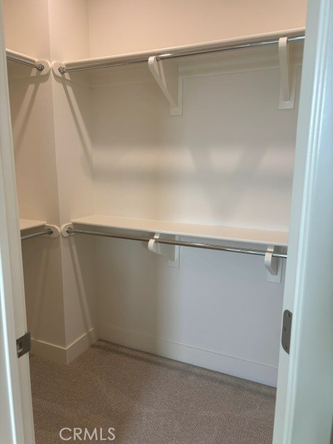 PrimaryBedWalkInCloset - 148 Pisano, Irvine CA 92618 - photo 6