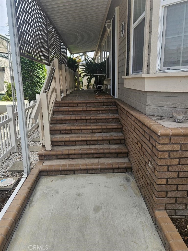 Walkway to front entry - 14851 Jeffrey Rd, SPC 142, Irvine CA 92618 - photo 19