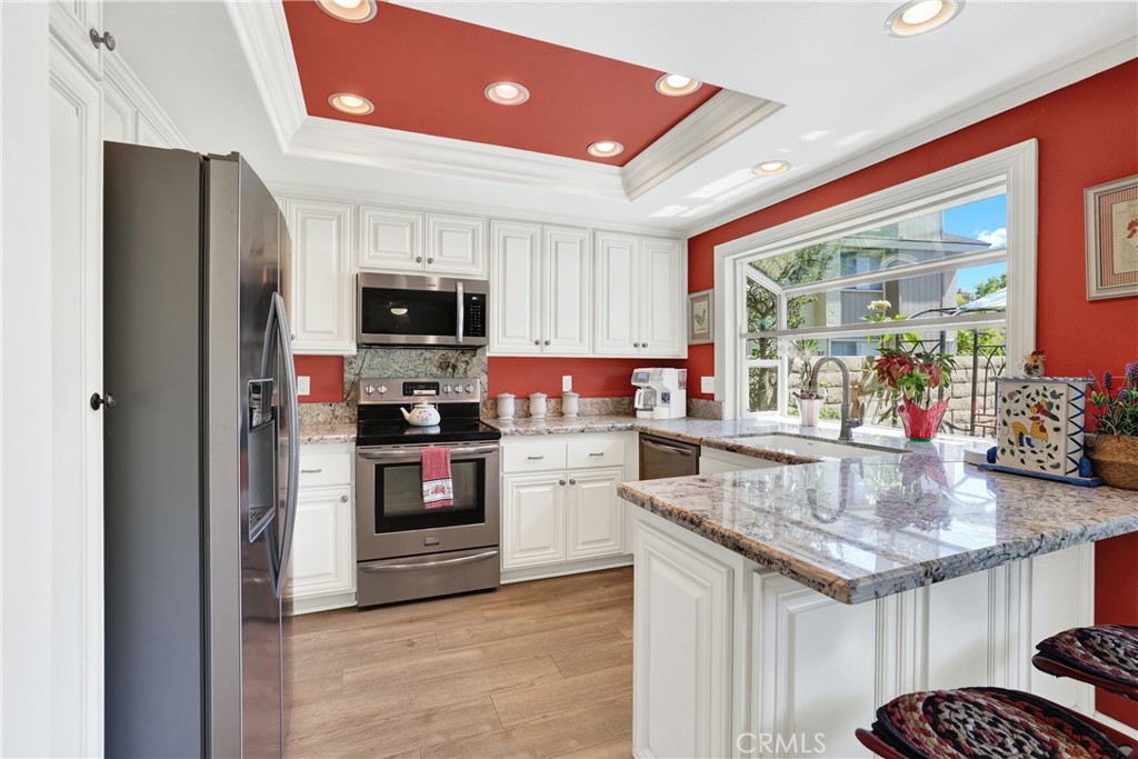 Nice updated Kitchen with bay window and roll out drawers in the cabinets. - 15 Snapdragon 8, Irvine CA 92604 - photo 3