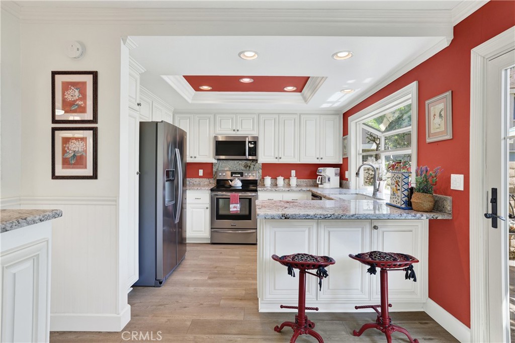 Nice updated Kitchen with bay window and roll out drawers in the cabinets. With views of the yard. - 15 Snapdragon 8, Irvine CA 92604 - photo 13