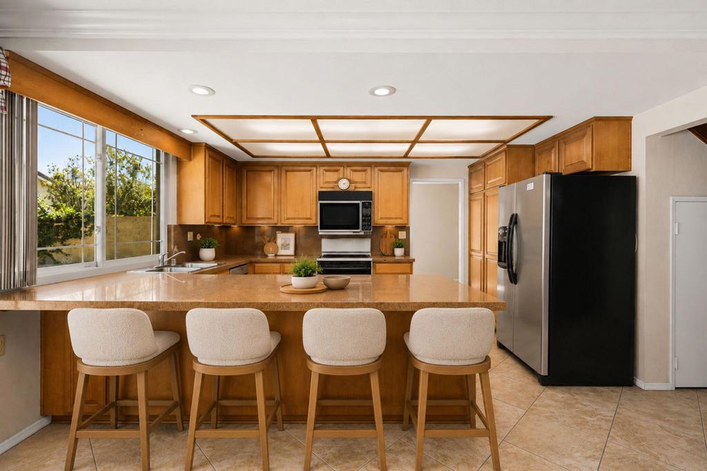 63-web-or-mls-staged_kitchen_4_barstools - 15432 Cherbourg Avenue, Irvine CA 92604 - photo 15