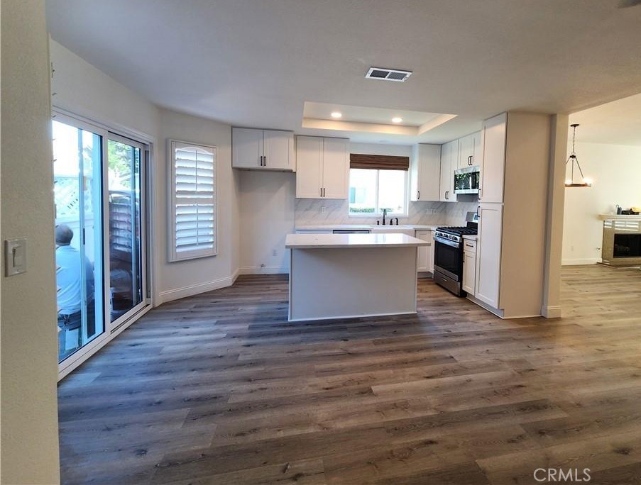 Kitchen view from family room. - 168 Greenmoor 72, Irvine CA 92614 - photo 10