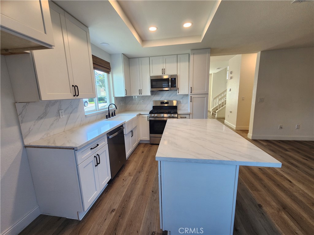 Kitchenwith cabinets-range-microwave-dishwasher. - 168 Greenmoor 72, Irvine CA 92614 - photo 12